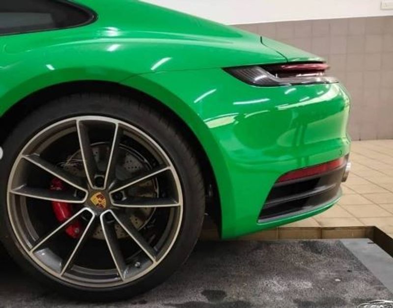 Fahadh Faasil and actress Nazria Nazim with their new Porsche 911 Carrera