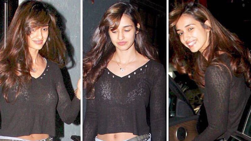 दिशा पाटनी ब्लैक टॉप और शॉर्ट्स में बेहद खुश नजर आई।