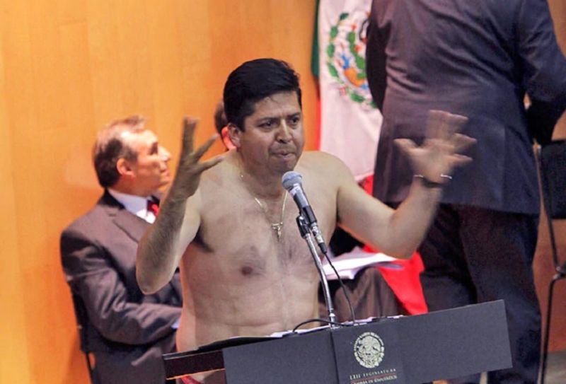 Mexican Congressman Antonio Garcia Conejo strips to protest energy privatisation bill dpl