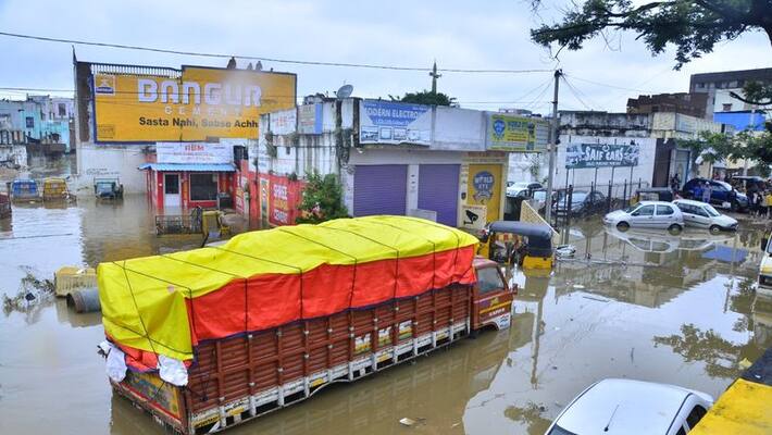 Telangana rains: Car washed out in Musi river fllods, two die Telangana rains: Car washed out in Musi river fllods, two die
