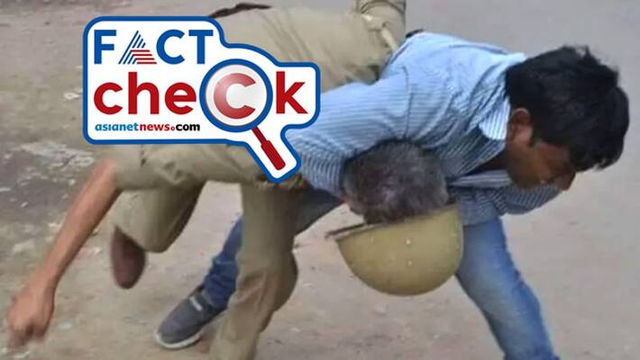 reality of man thrashing a police personnel in social media with a claim that BJP goons are beating cops in Bengal reality of man thrashing a police personnel in social media with a claim that BJP goons are beating cops in Bengal