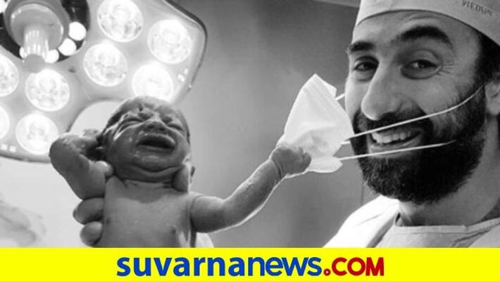 Viral Pic Of Baby Removing Doctors Mask Becomes Symbol Of Hope dpl Viral Pic Of Baby Removing Doctors Mask Becomes Symbol Of Hope dpl