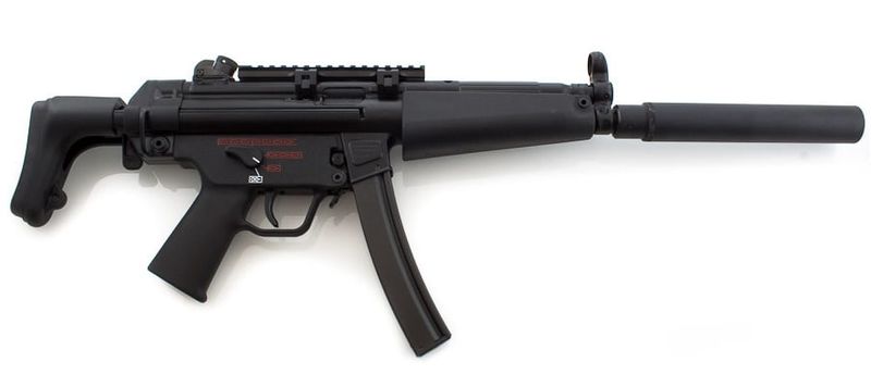 Manoj Abraham ips checking new MP5 rifle bought for the Kerala Police