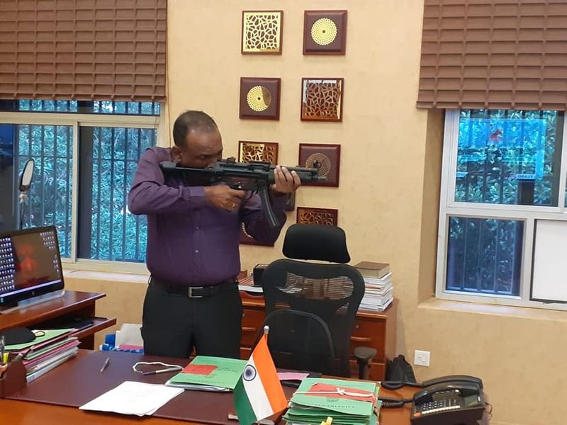 Manoj Abraham ips checking new MP5 rifle bought for the Kerala Police