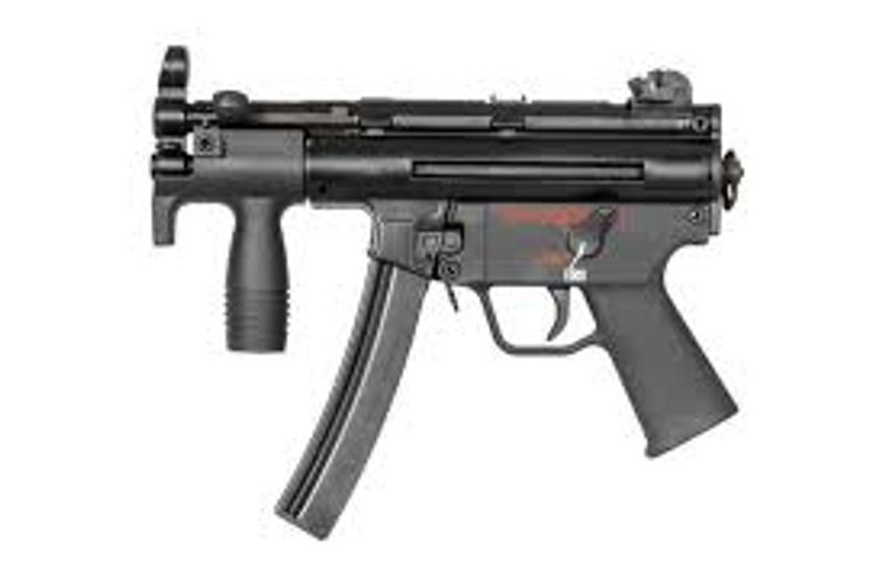 Manoj Abraham ips checking new MP5 rifle bought for the Kerala Police