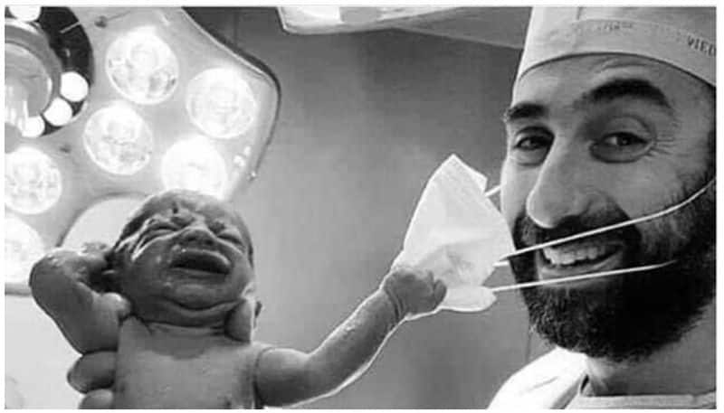 Newborn baby removing doctor's mask became viral in social media