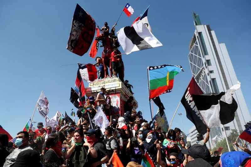 chilean protesters burn two churches photo story