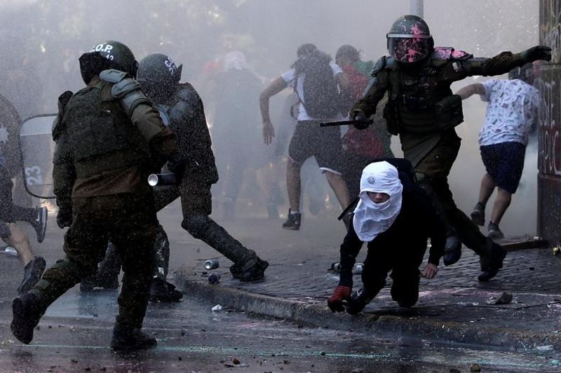 chilean protesters burn two churches photo story