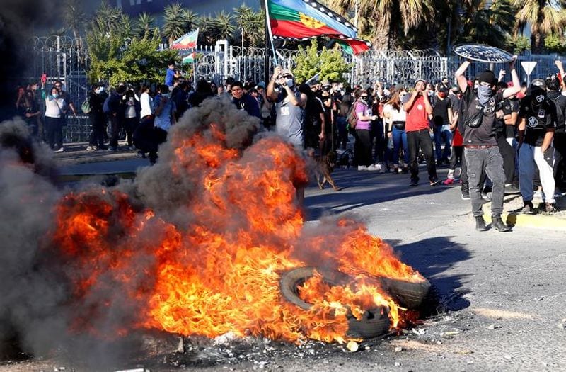 chilean protesters burn two churches photo story
