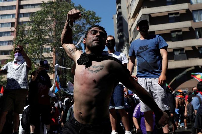 chilean protesters burn two churches photo story