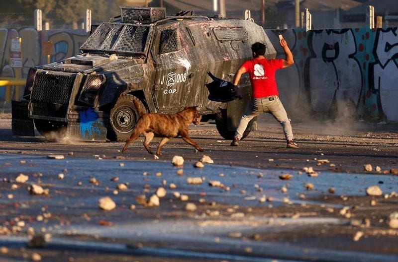 chilean protesters burn two churches photo story