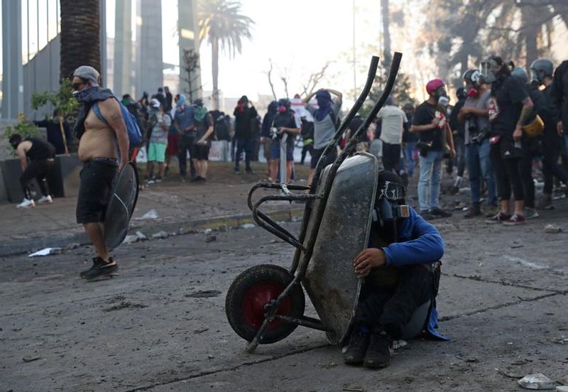 chilean protesters burn two churches photo story