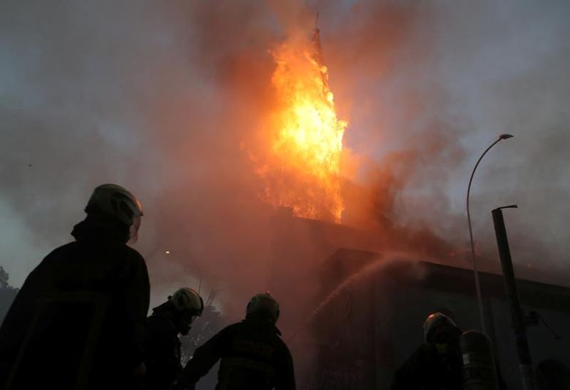 chilean protesters burn two churches photo story