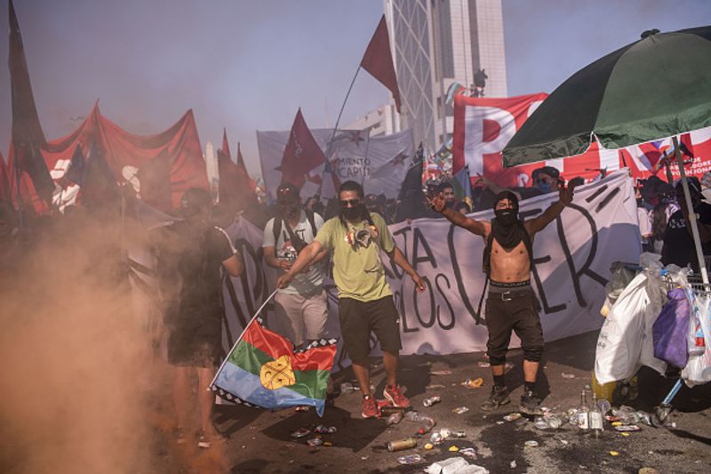 chilean protesters burn two churches photo story