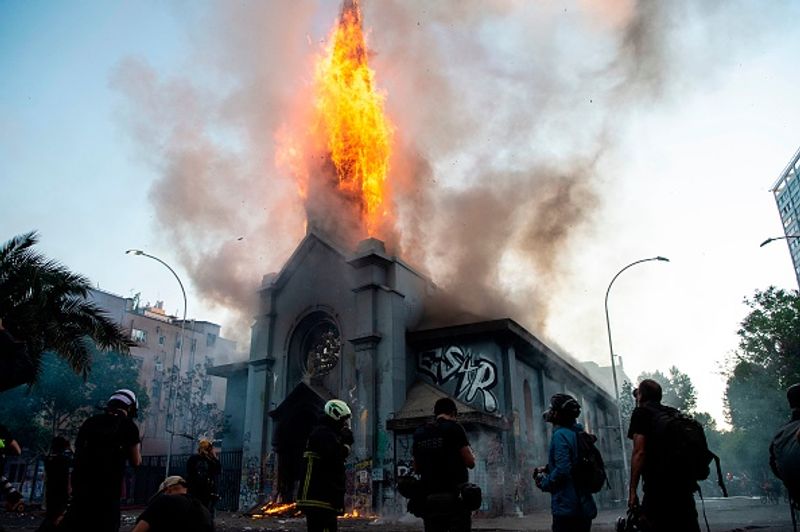 chilean protesters burn two churches photo story