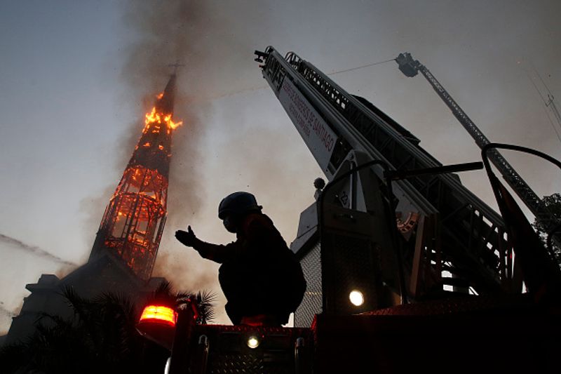 chilean protesters burn two churches photo story