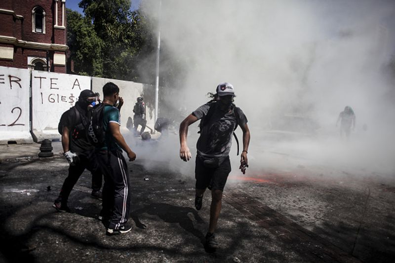 chilean protesters burn two churches photo story