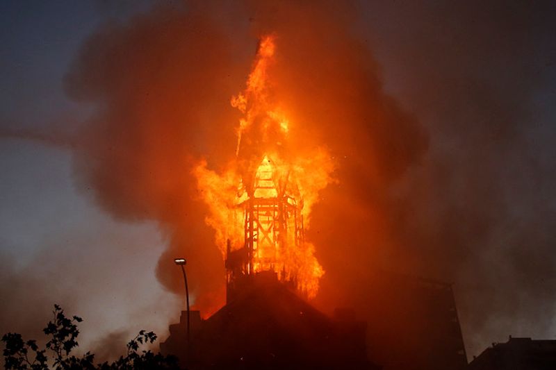 chilean protesters burn two churches photo story