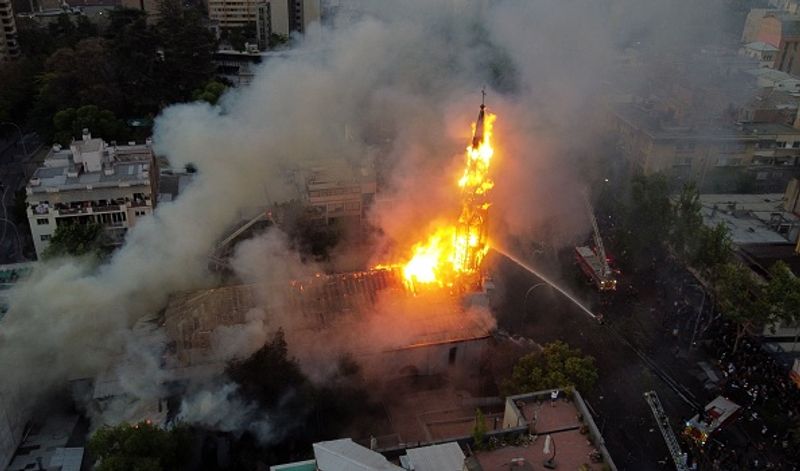 chilean protesters burn two churches photo story
