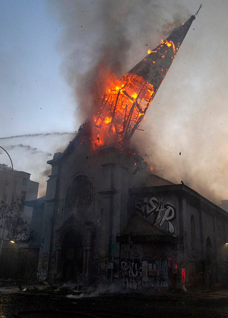 chilean protesters burn two churches photo story