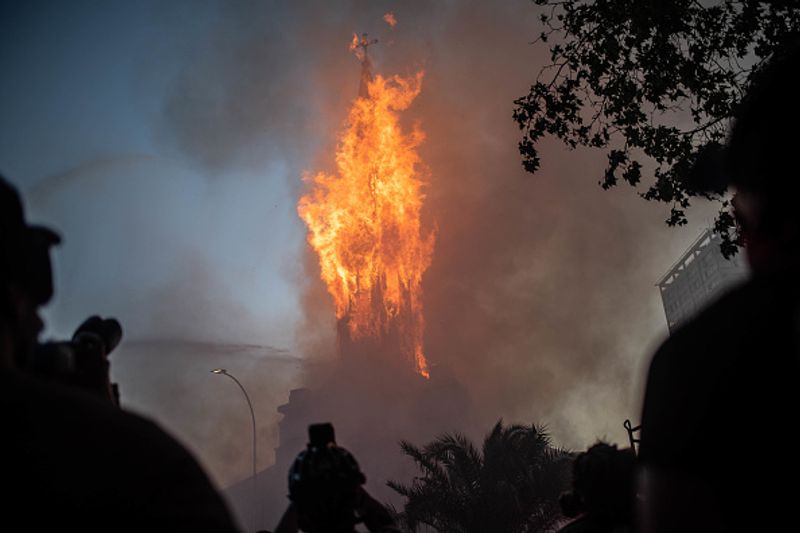 chilean protesters burn two churches photo story