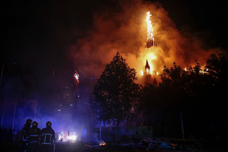 chilean protesters burn two churches photo story