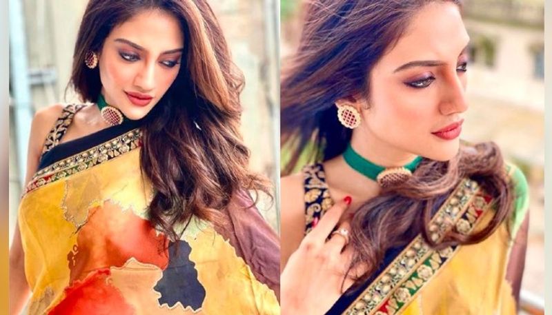 Nusrat Jahan flaunts her beauty in a sequined blue saree ADB