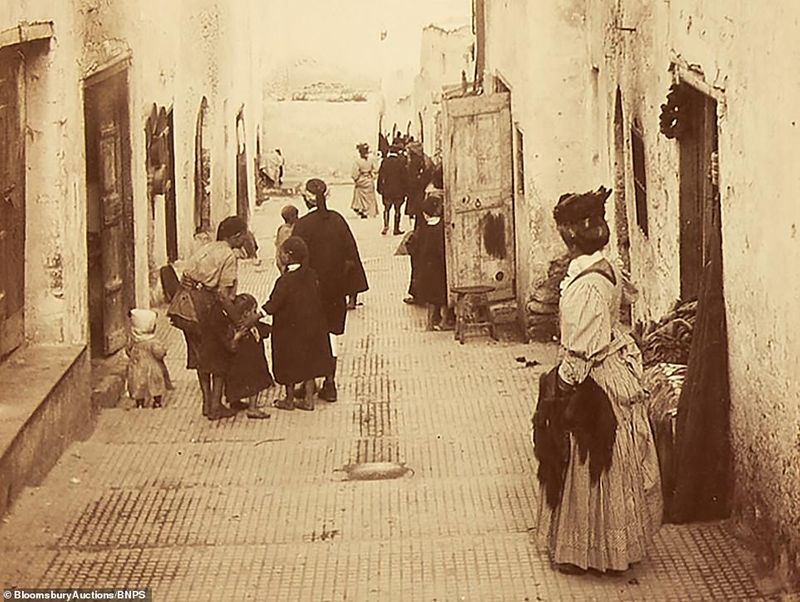112 year old family album contains photos and postcards