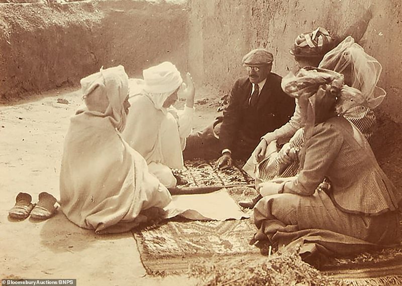 112 year old family album contains photos and postcards