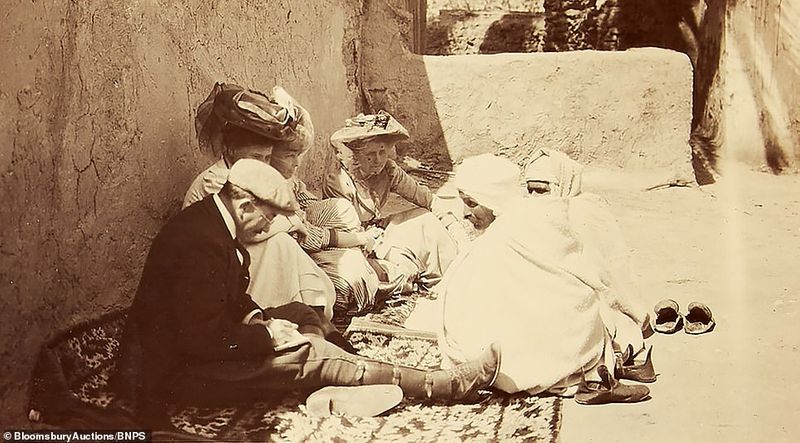112 year old family album contains photos and postcards