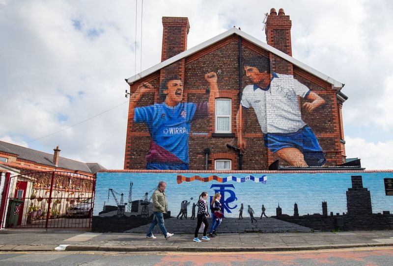 football players mural painting in world cities