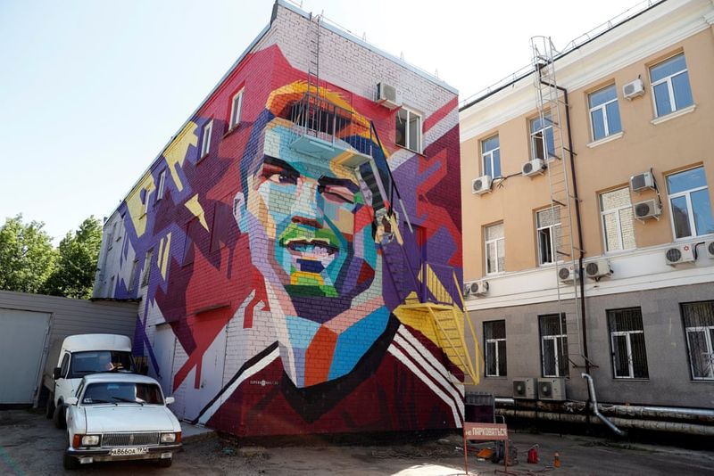 football players mural painting in world cities