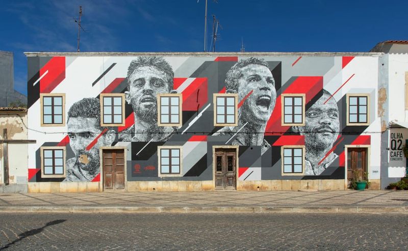 football players mural painting in world cities