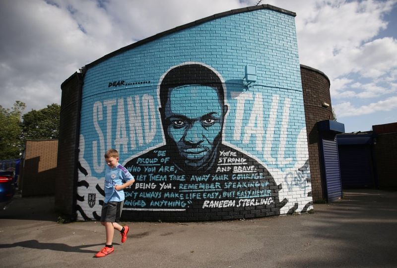 football players mural painting in world cities
