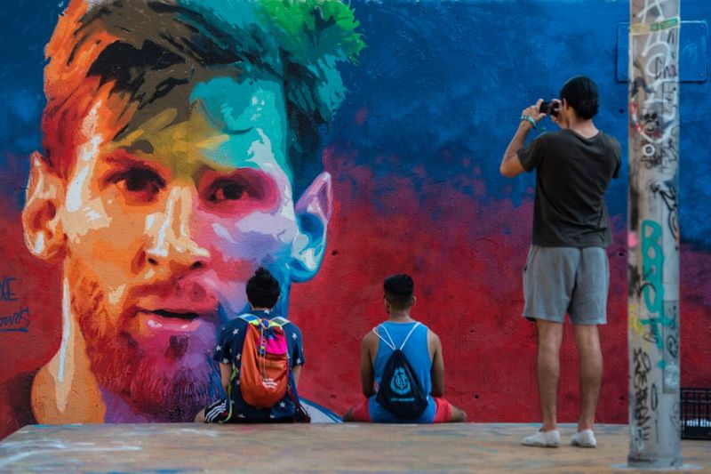 football players mural painting in world cities