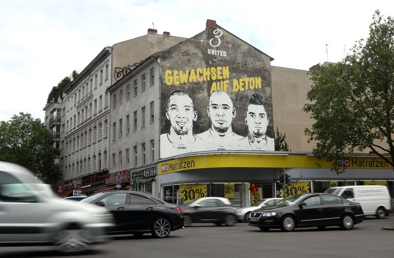 football players mural painting in world cities