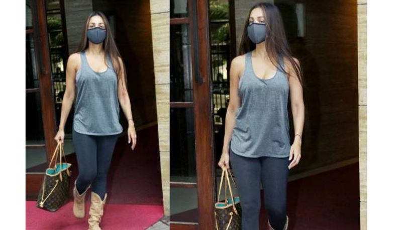 Malaika Arora in basic tee and pants with Rs 1.2 lakh bag