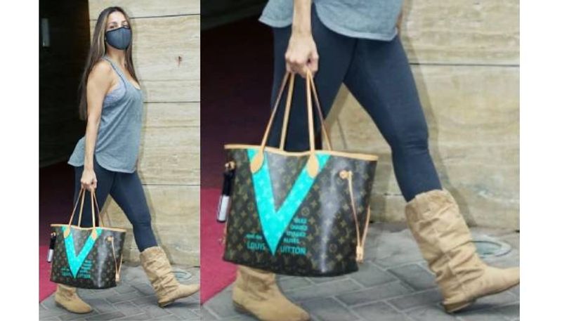 Malaika Arora in basic tee and pants with Rs 1.2 lakh bag
