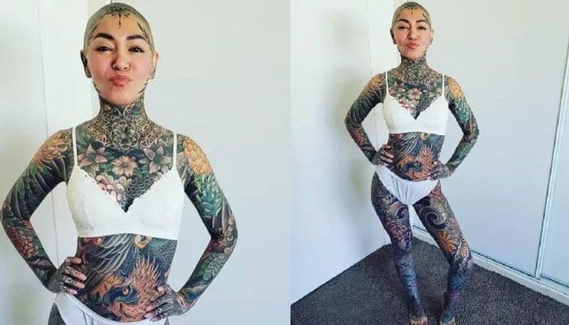 Woman tattooed head to toe