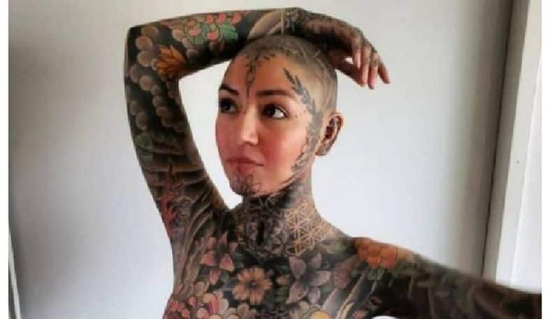 Woman tattooed head to toe