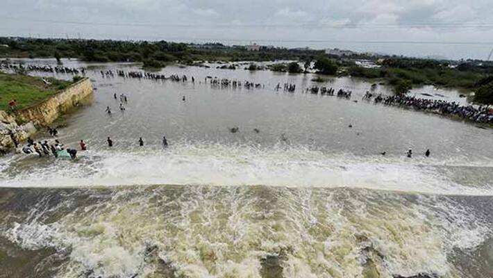 Due to heavy rain water is being released from Chembarambakkam lake this afternoon Due to heavy rain water is being released from Chembarambakkam lake this afternoon