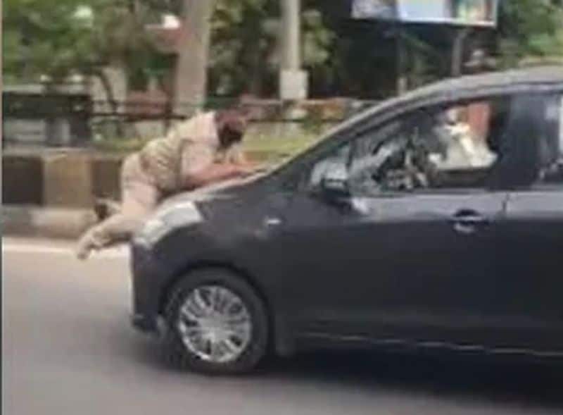 Traffic policeman car bumper rash errant drivers-VPN