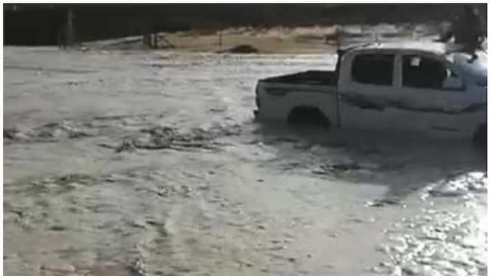car driver rescued while crossing valley during heavy water currents car driver rescued while crossing valley during heavy water currents
