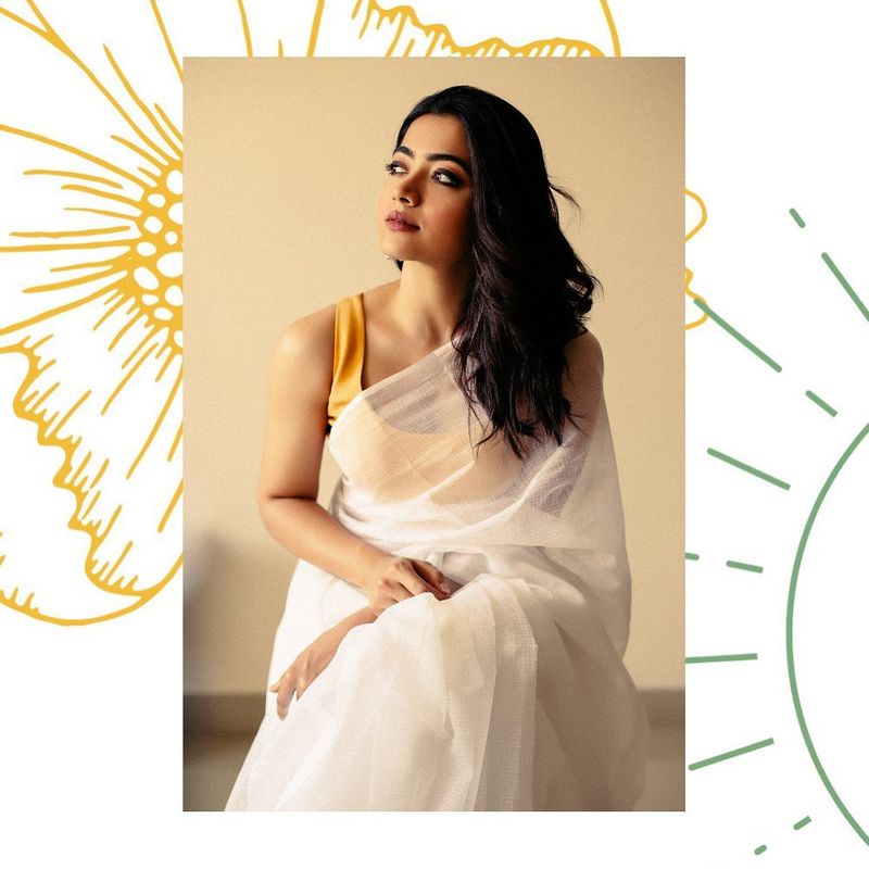 A sober saree
Do not go overboard with sarees, just like Rashmika wear a sober, plain saree and pair it with a contrasting blouse to look stunning and beautiful.