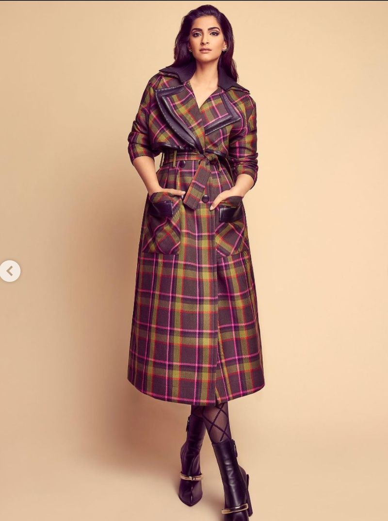 Stunning in a checkered overcoat
Sonam Kapoor and power dressing go hand-in-hand. She once wore a stunning checkered long overcoat that had bold colors and paired it with high-boots looking edgy and extremely presentable. 
