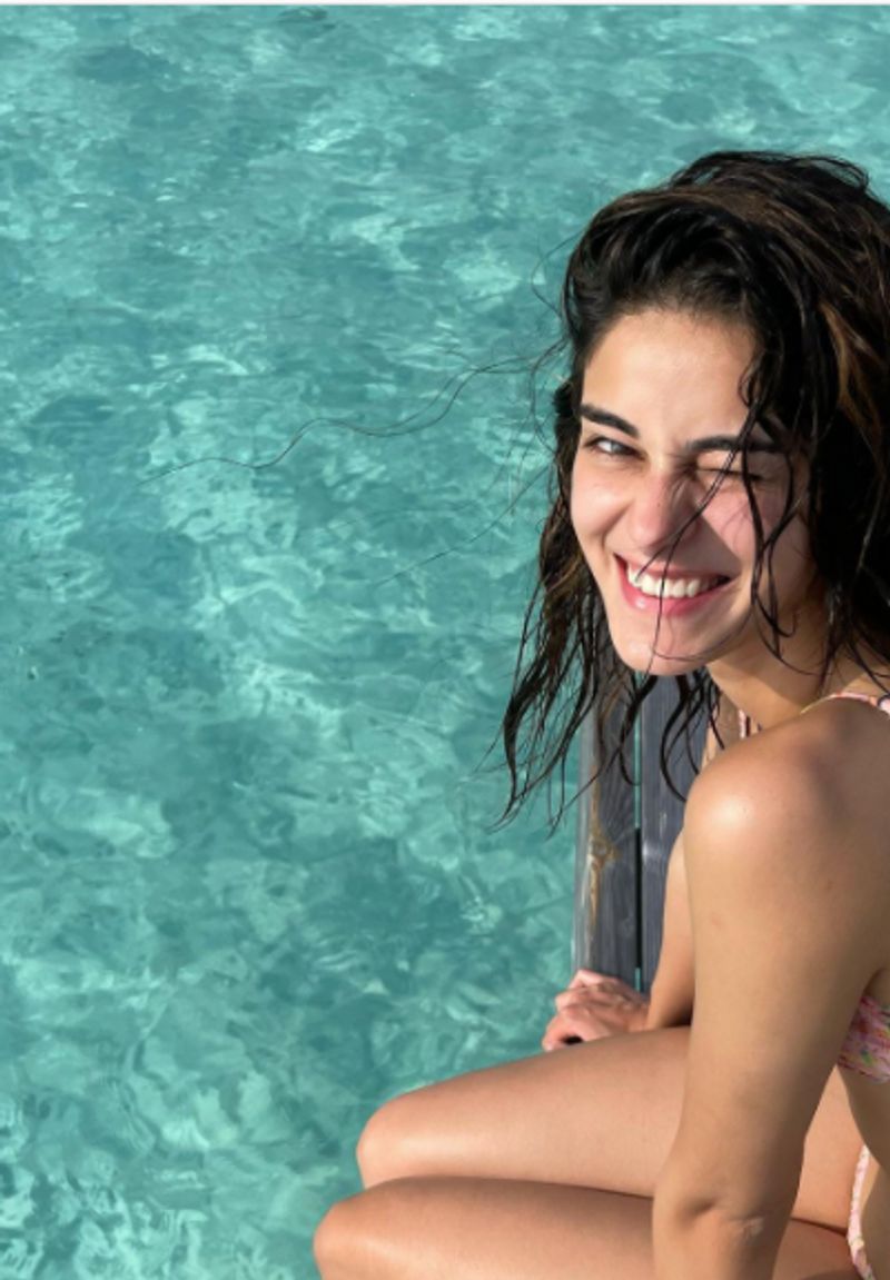 Ananya Panday
Ananya wore a simple printed peachy-pink bikini to her trip to Maldives. The bikini had a stunning knot detailing at the back.