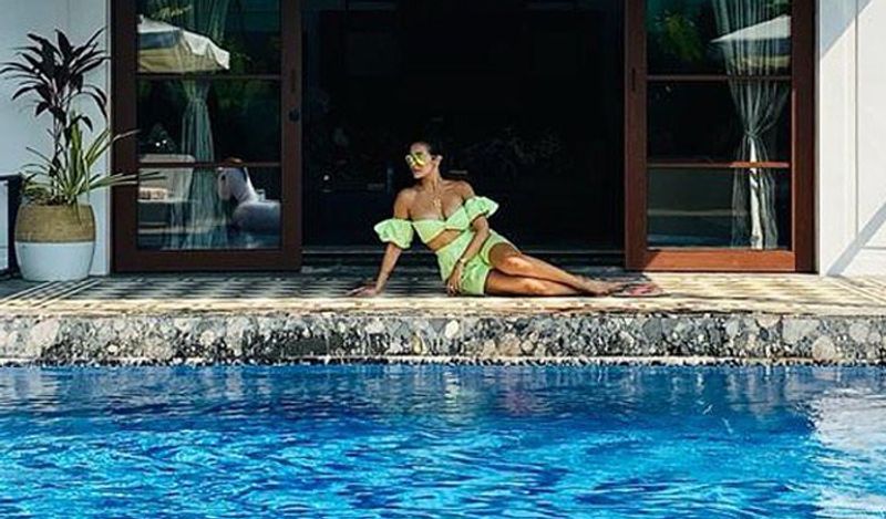 <p>Malaika Arora loves to wear bikinis and co-ord sets. Here she is looking extremly sexy as she strikes a pose near the pool.</p>