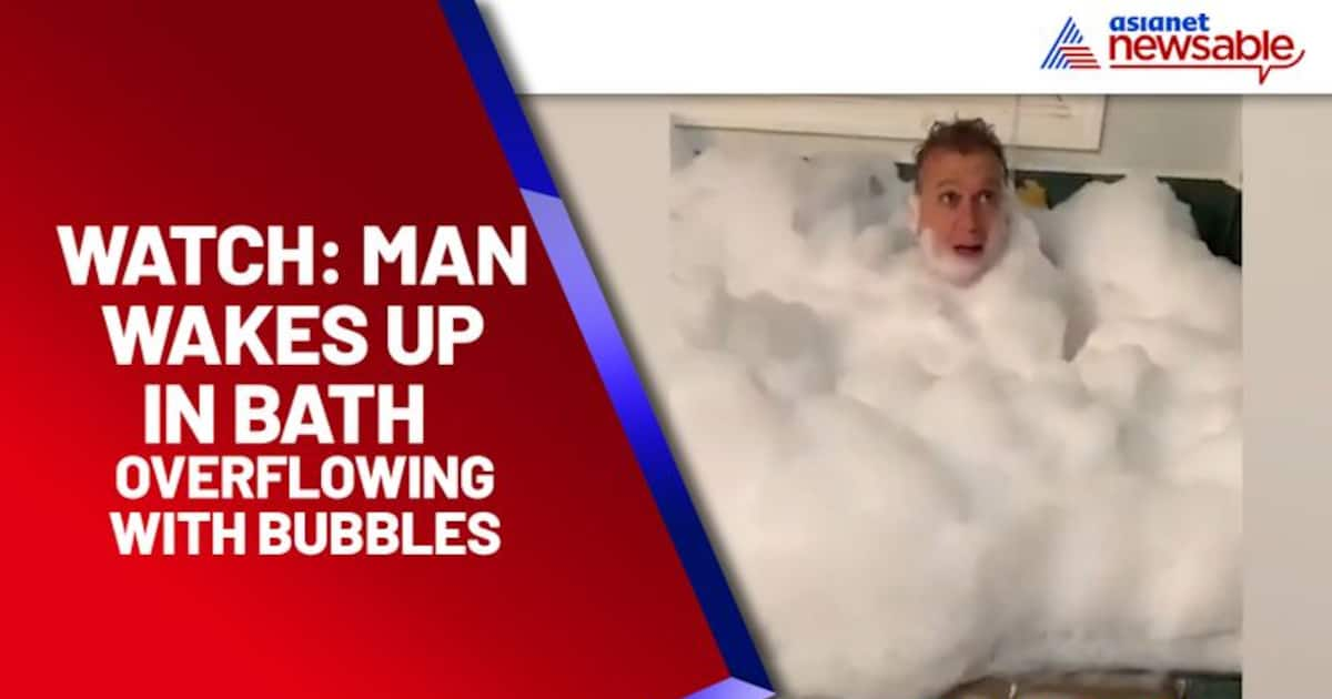 After falling asleep man wakes up in bathtub overflowing with bubbles