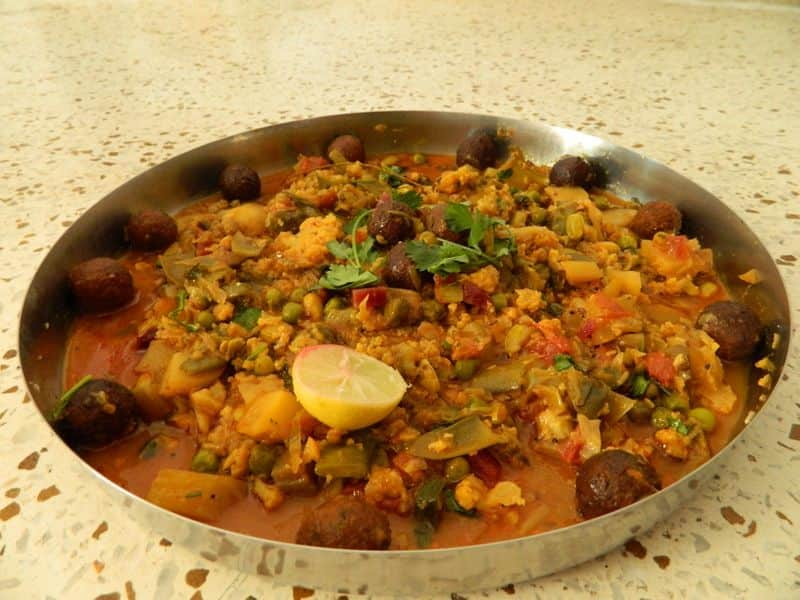 Undhiyu – Gujarat: This mixed veg delicacy is Gujarat's winter staple. Did you know Undhiyu is derived from the word 'Undhu' which means upside down in Gujarati? The dish was traditionally cooked underground, that too upside down in earthen pots. Nowadays, you can use your pressure cookers or heavy bottom pans to cook the same, and here's a recipe you should definitely try. It comprises the goodness of yam, potatoes, raw bananas, beans, kasoori methi, and so much more. This wholesome dish is sure to be a hit even with your kids!