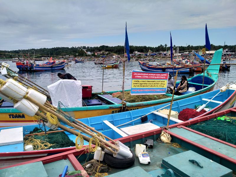 Sand dredging lobster workers protest in sea at Kovalam